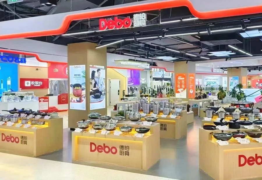 A Debo branded store with a red fascia and light-wood shelving